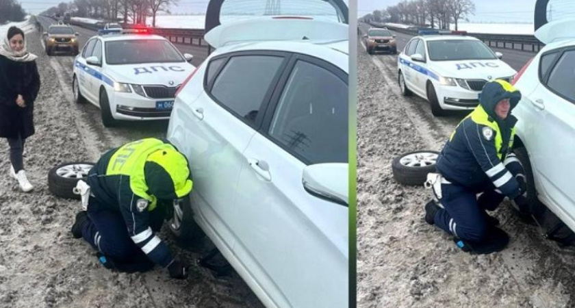 Воронежские автоинспекторы помогли автоледи заменить пробитое колесо на трассе